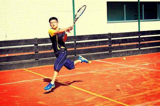 ISSFT student playing tennis