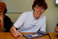 Business class student at ISSFT summer school writing with Ipad