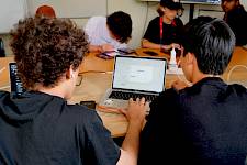 ISSFT CODING STUDENTS IN FRONT OF A LAPTOP