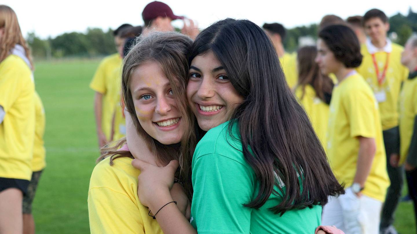 Two Happy ISSFT students hugging