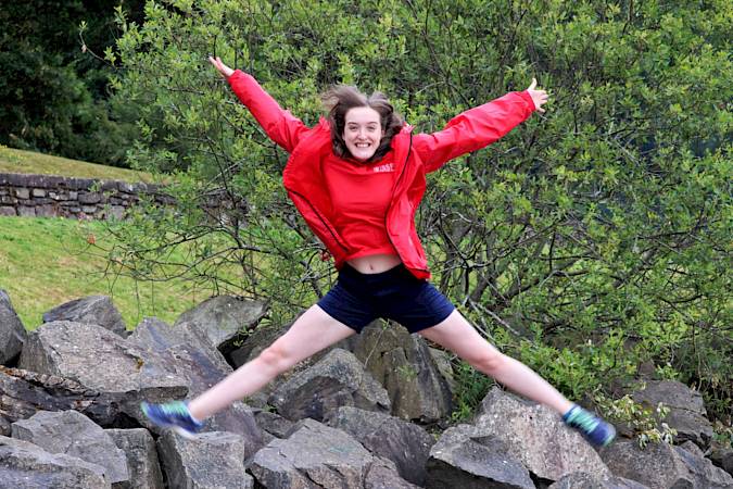 ISSFT staff member doing a star jump