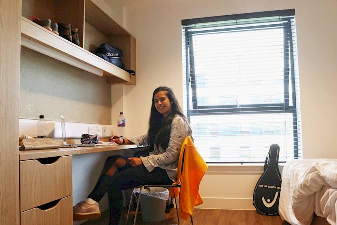 ISSFT student siting in their room