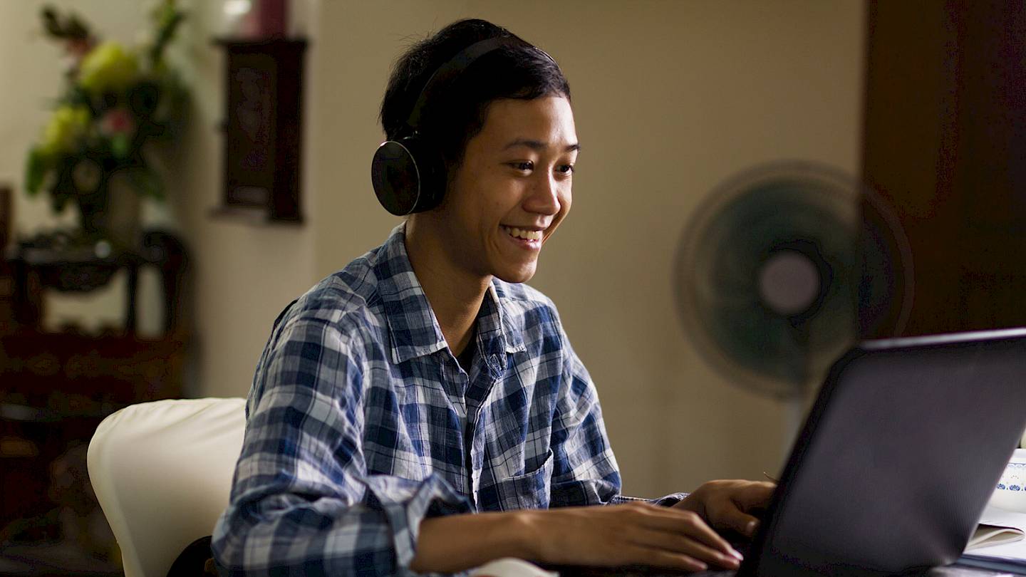 Student interacting with laptop placeholder