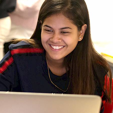 ISSFT student working on her laptop