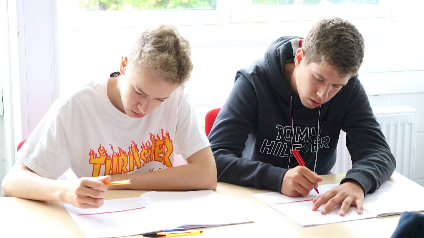 ISSFT students working at their desk during class