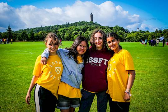 summer school girls standing on sports field